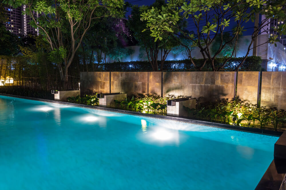Pool Lighting in Backyard at Night for Family Lifestyle and Living Area.