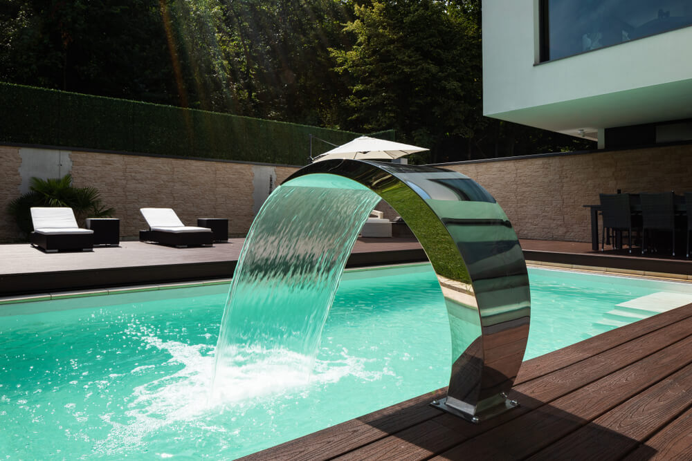 Detail of Swimming Pool With Fountain in Modern Villa. Nobody Inside