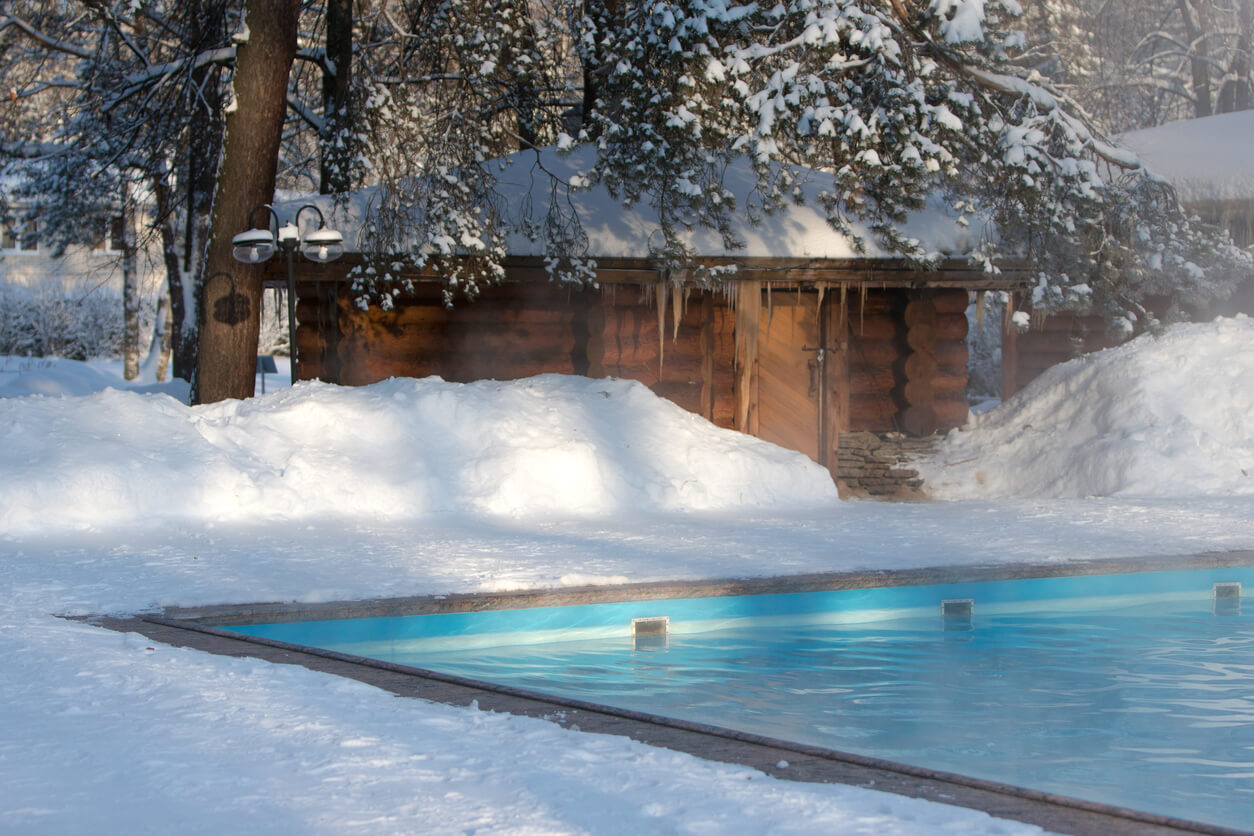 Warm Swimming Pool With Blue Water and Wooden Russian Bath in Sunny Winter Weather, Outdoor.