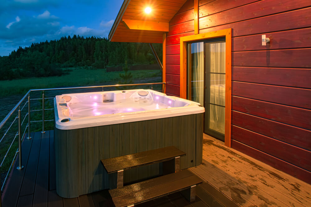 The Illuminated Hot Tub Is Filled With Water. Spa Treatments in the Fresh Air.
